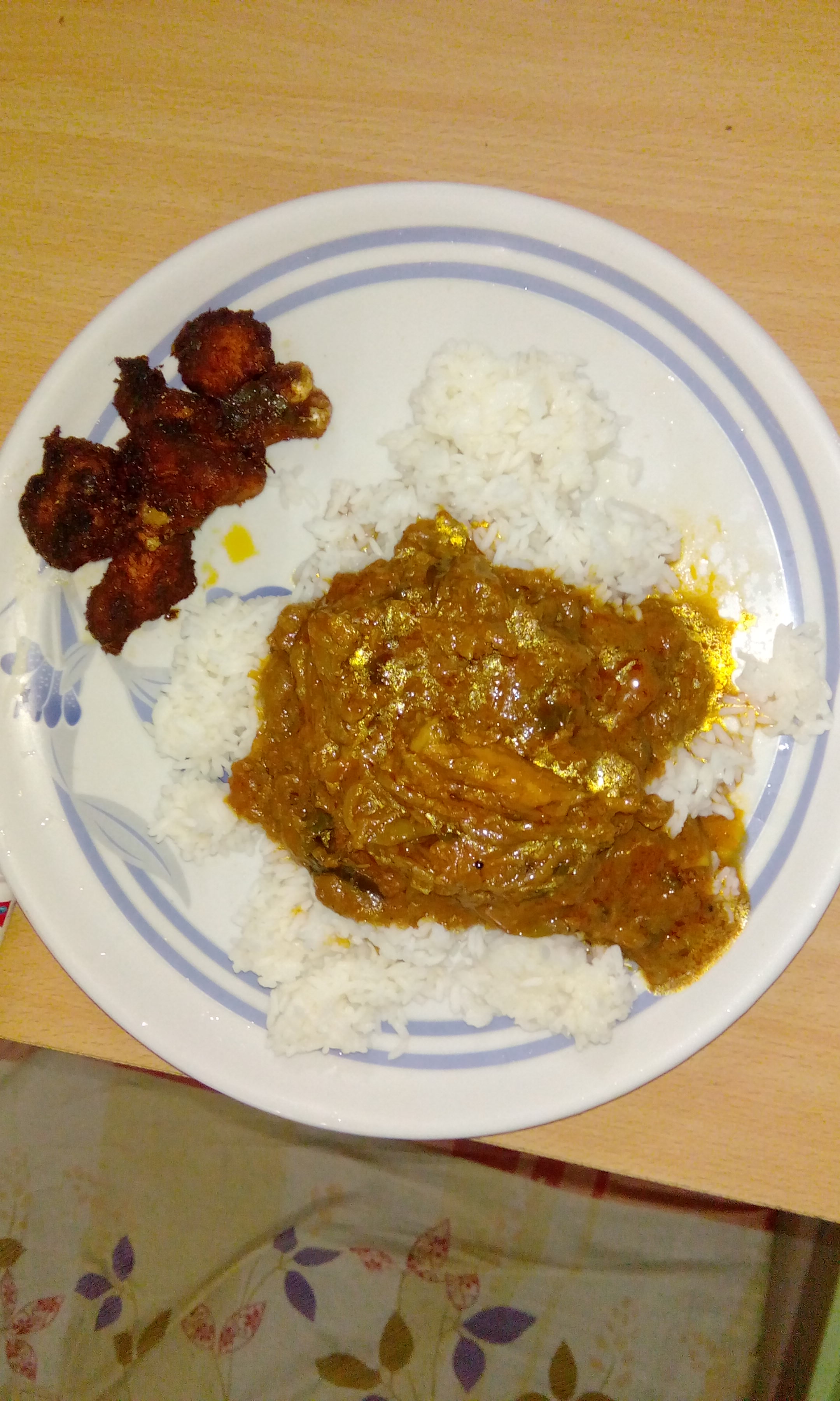 Meals with chicken curry, chicken fry, homely food.