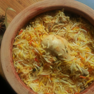 chicken biryani with beetroot raita and boiled egg